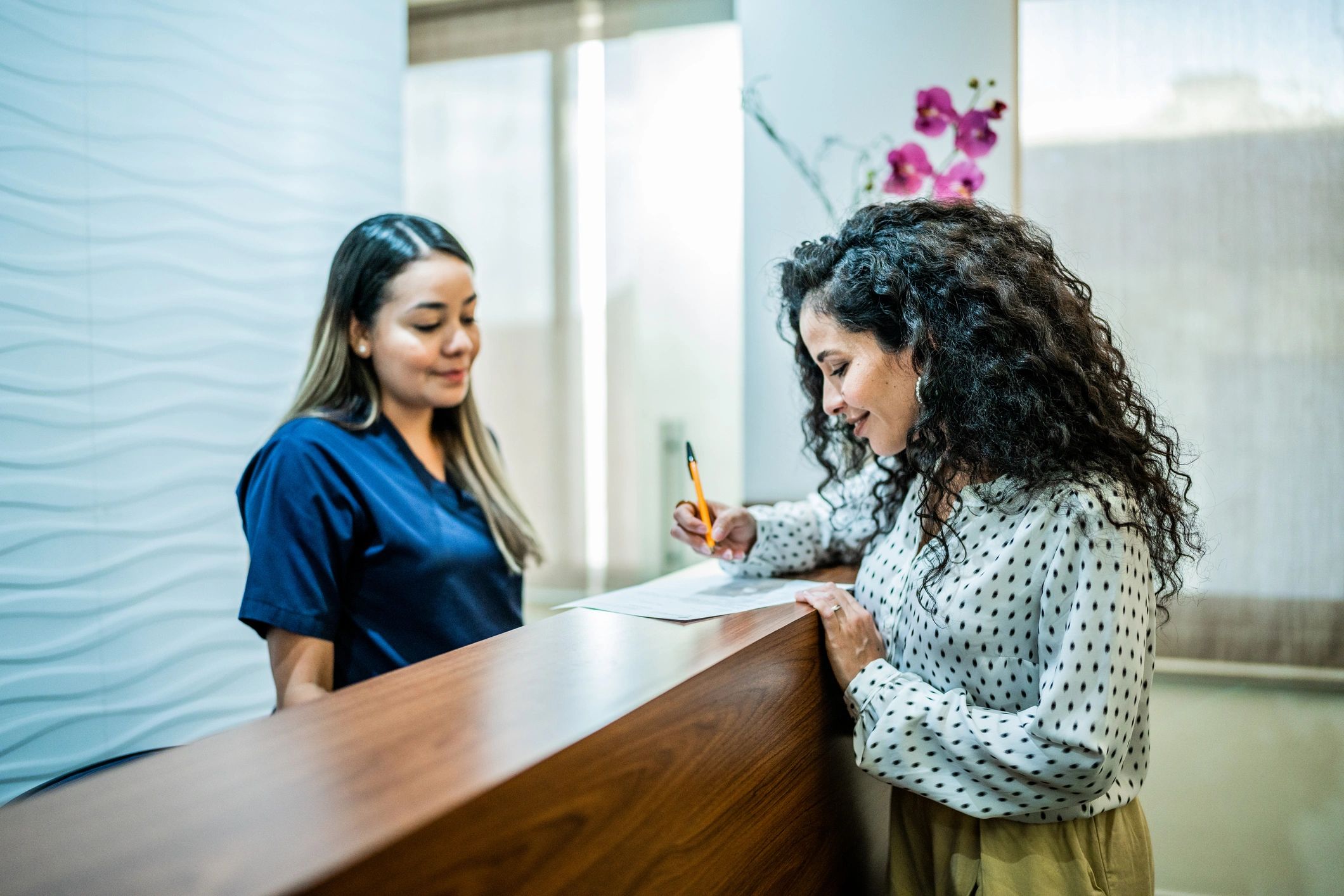 Adult patient at a dental office reception area