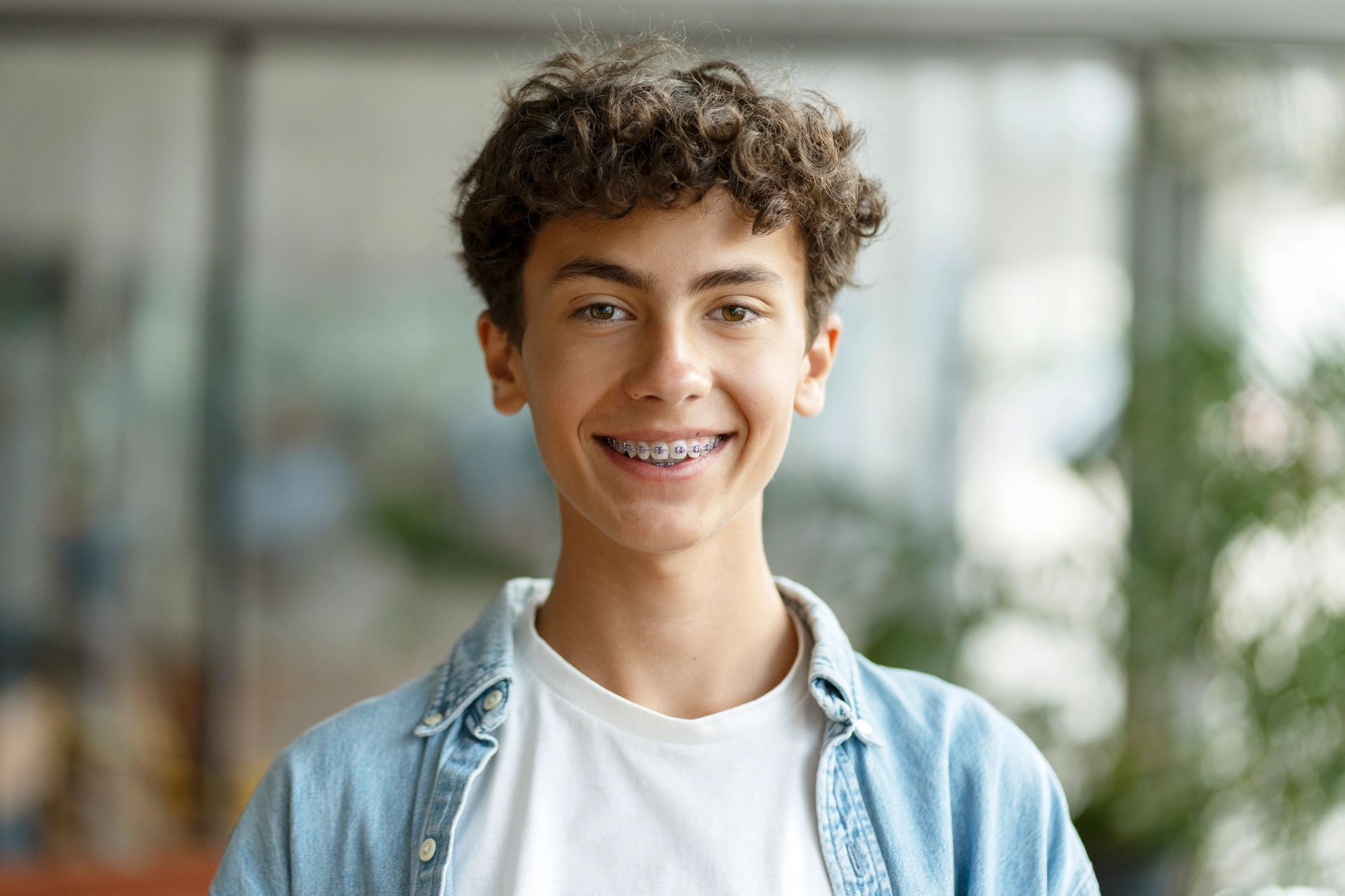 Smiling school-age boy wearing braces