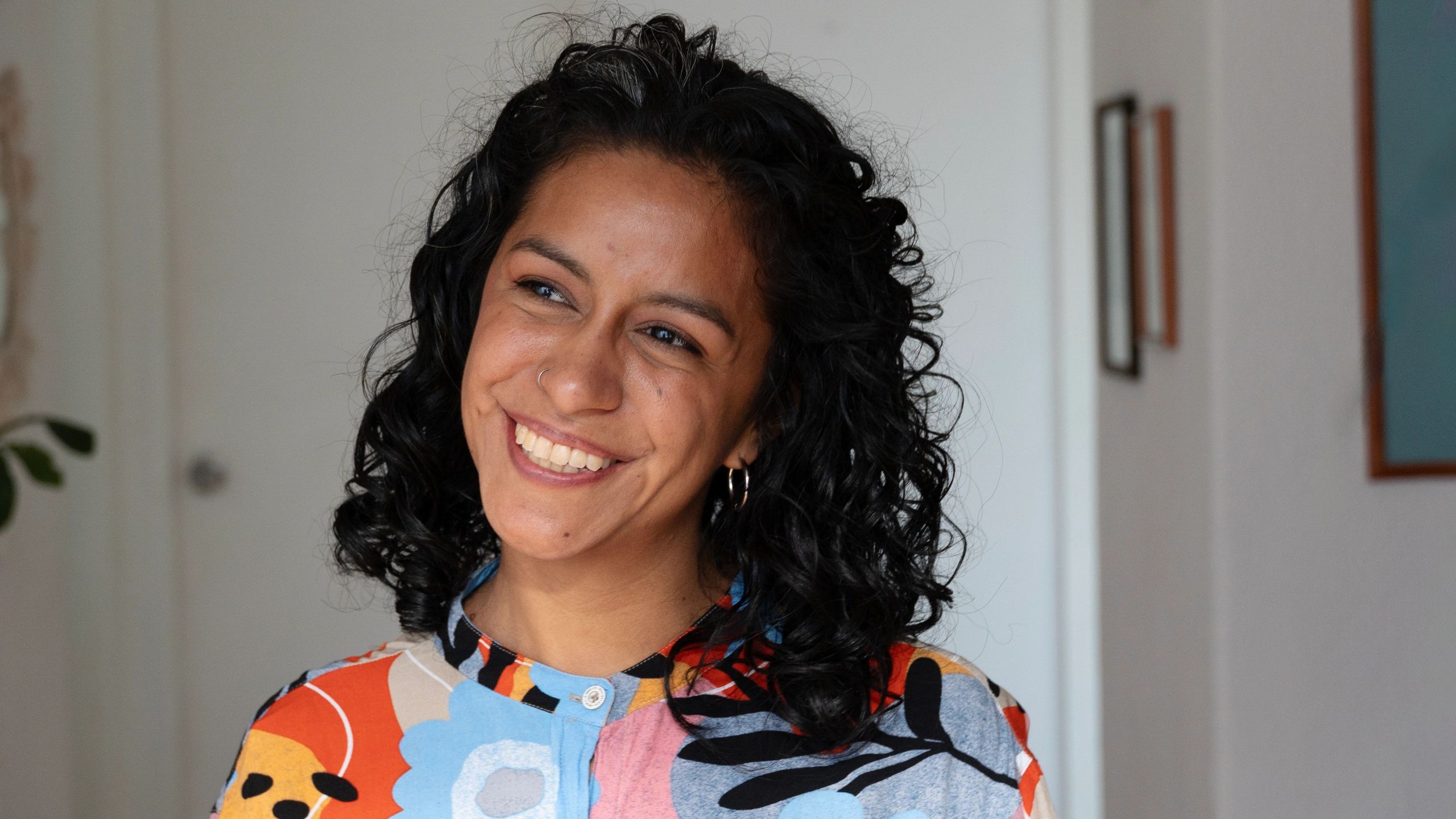 Adult woman smiling confidently, representing clear aligner treatment