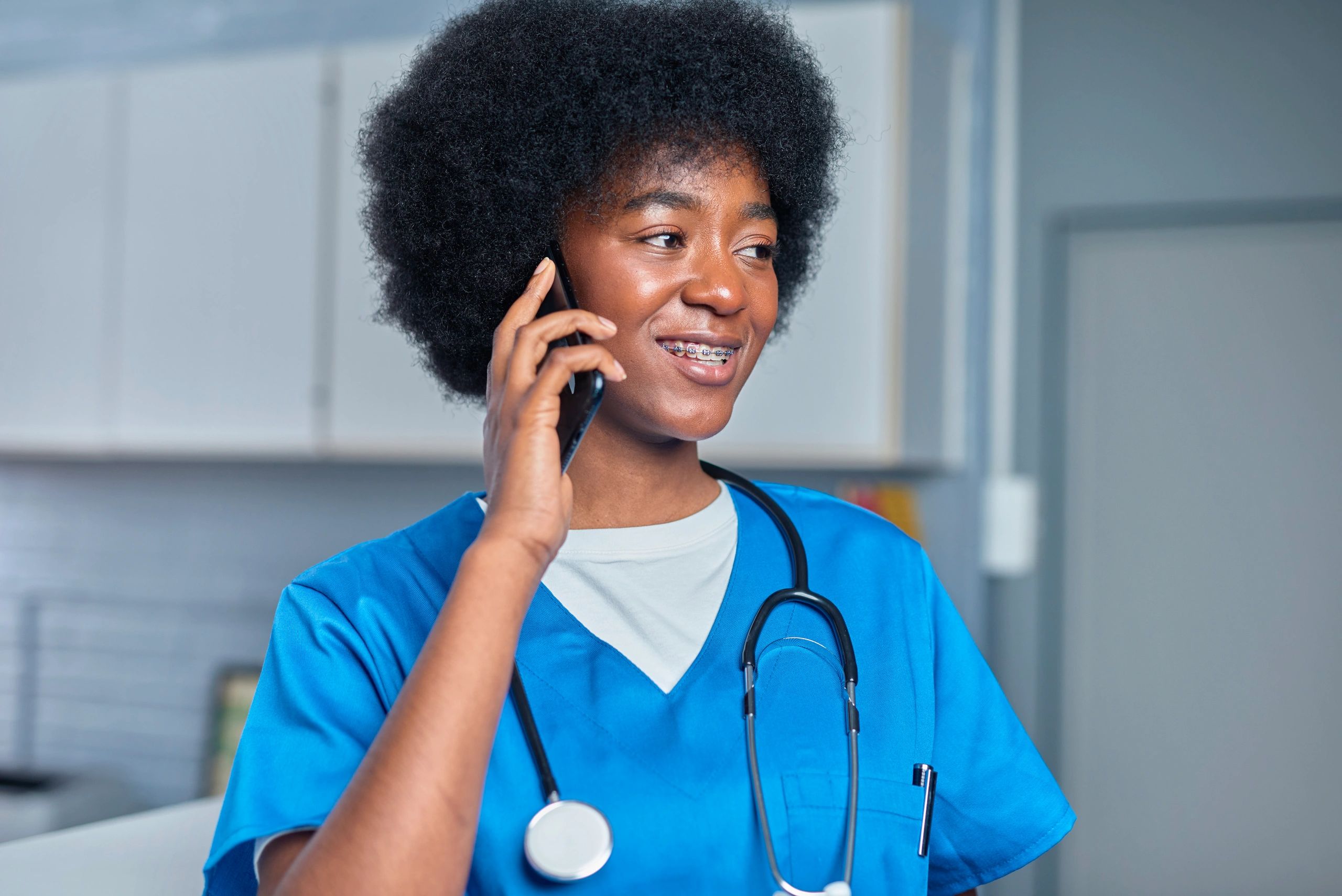 Smiling healthcare professional in a clinical setting