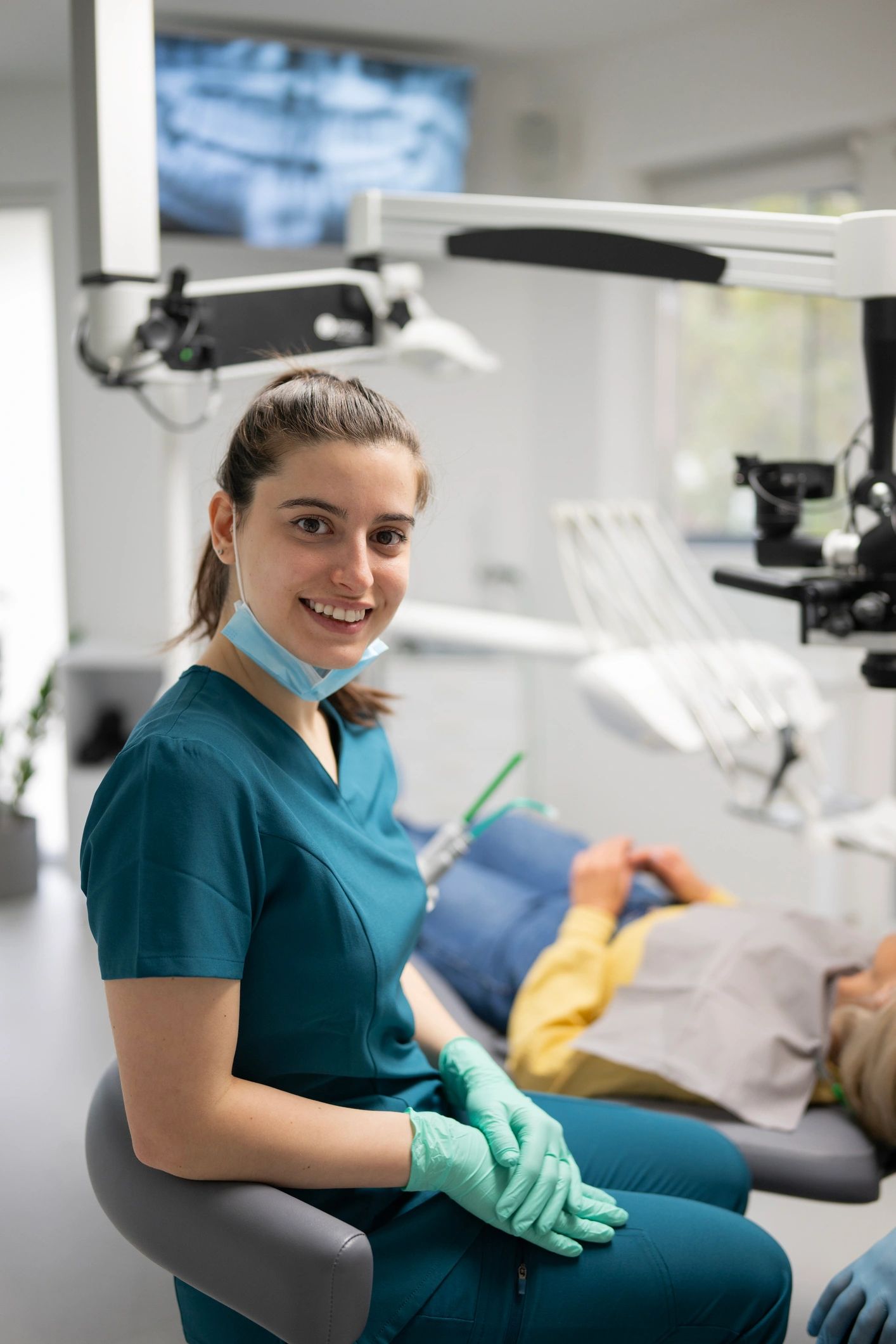 Female orthodontic professional smiling in a modern clinic